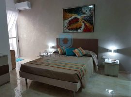 QAWRA- MODERN & FURNISHED THREE BEDROOM APARTMENT WITH BACK YARD FOR-SALE